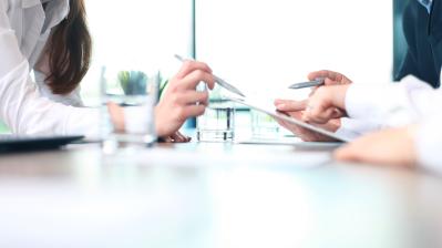 Business adviser analyzing financial figures denoting the progress in the work of the company